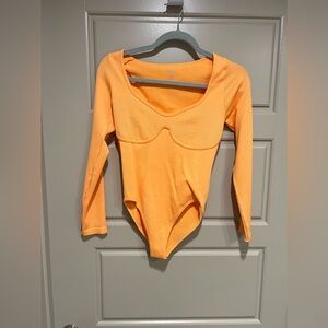 Orange ribbed body suit